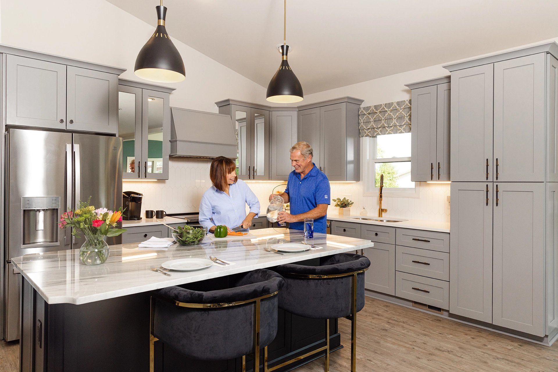 Berkeley Square senior living couple preparing food in a modern independent living home kitchen