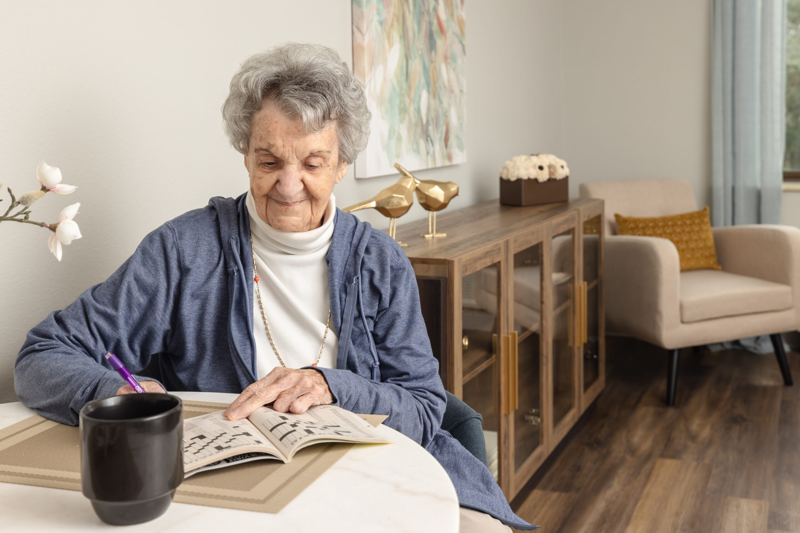 older women with grey hair sitting at a table