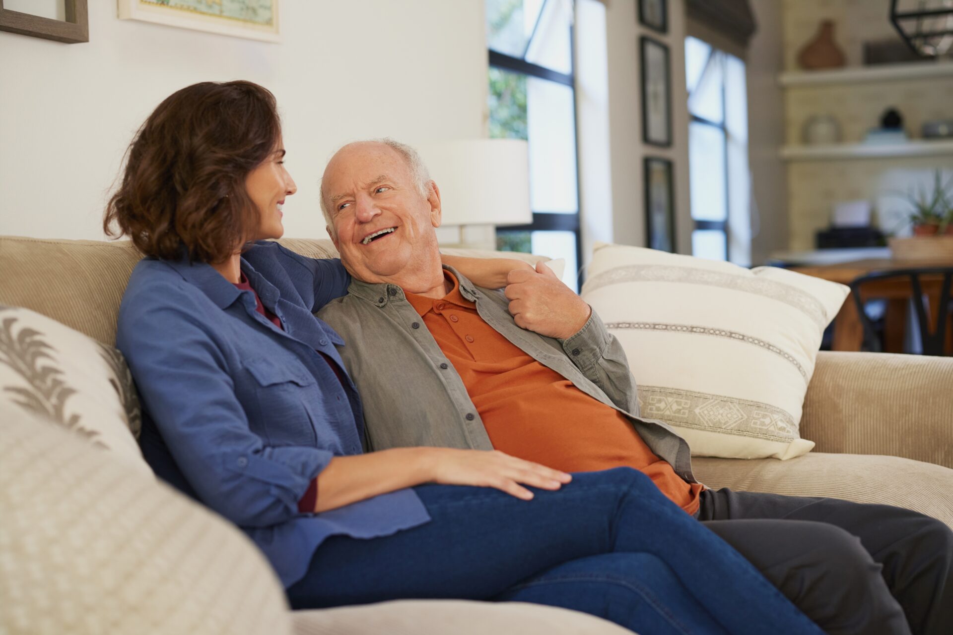 Senior father and adult daughter having a heartfelt conversation