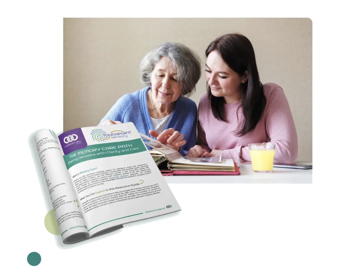 adult daughter with elderly mother, memory care, photo album, memory care